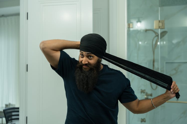 Bearded Man Wrapping A Turban