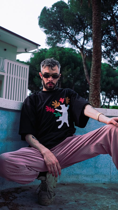 Model Posing in Tshirt and Pink Pants