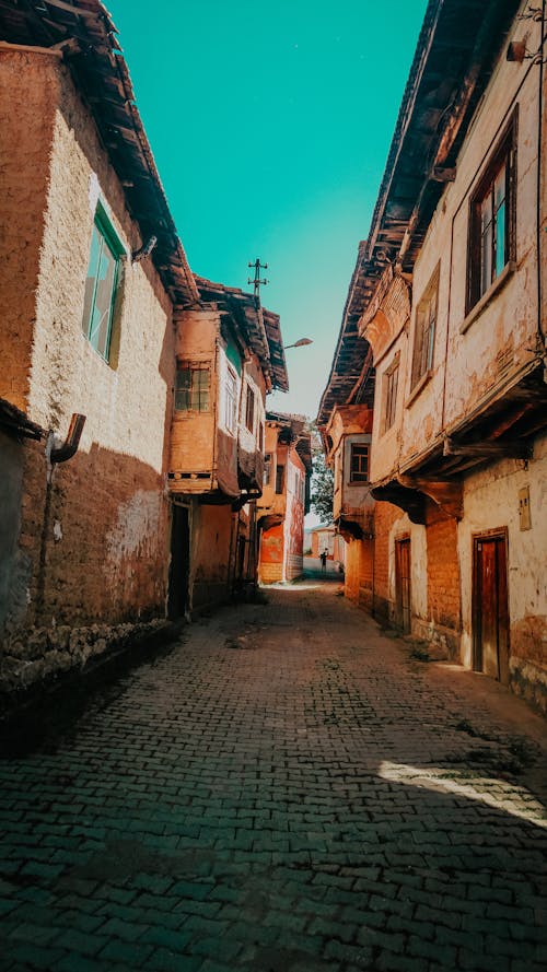 Narrow Cobblestone Street with Old Houses