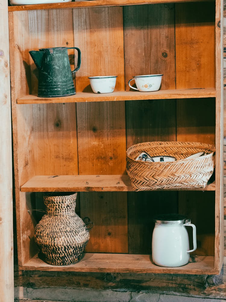 Pot, Pitcher And Basket On Vintage Furniture