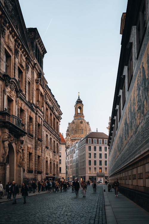 Pedestrians Walking along a Cobblestone Street in Dresden