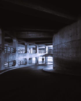Captivating silhouette of a person standing inside a concrete structure in Berlin.