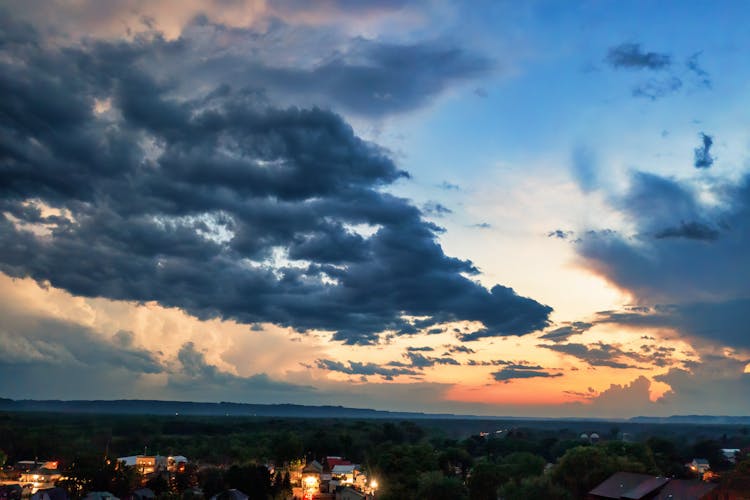 Clouds Over Town At Sunset