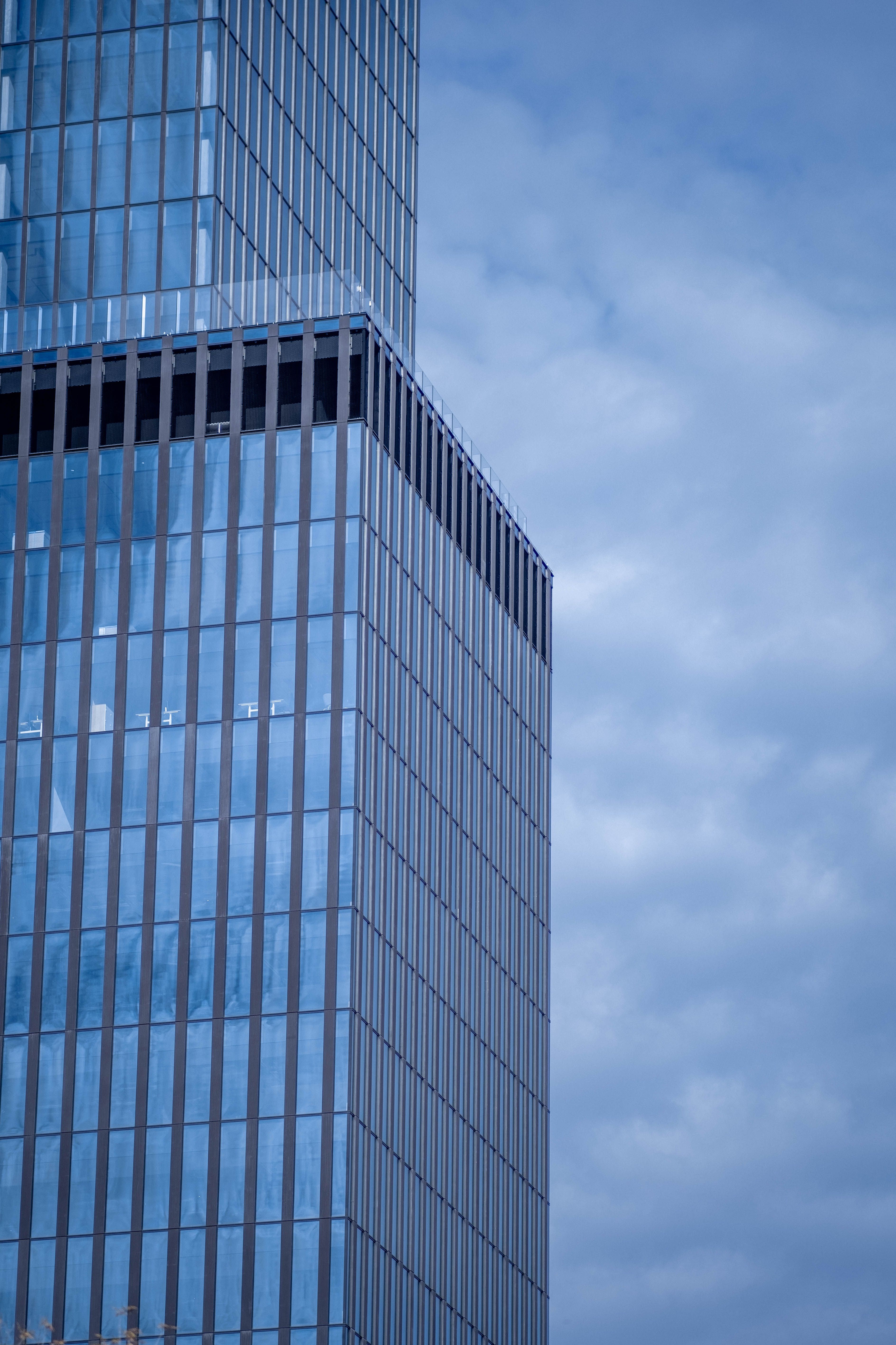 Glass Facade of Skyscrapers on Cloudy Day · Free Stock Photo
