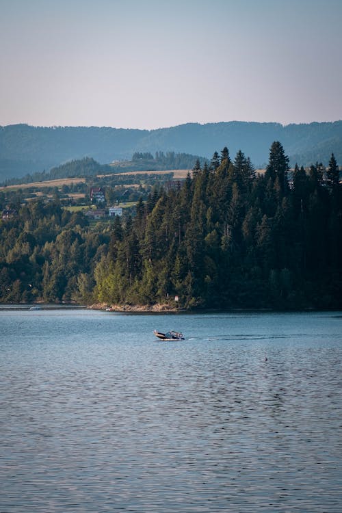 boat in the middle of the lake in Czorsztyn, Poland