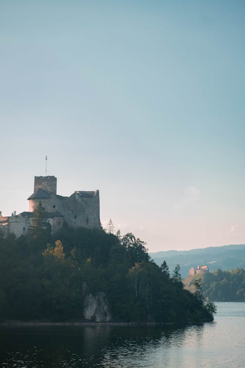 Old castle on the bank of the mountain by the lake in Czorsztyn, Jezioro Czorsztyńskie