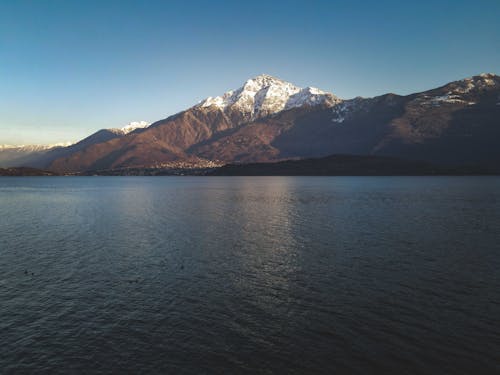 Lake Como at the Foot of Barren Snowcapped Monte Legnone in Bergamo Alps Italy