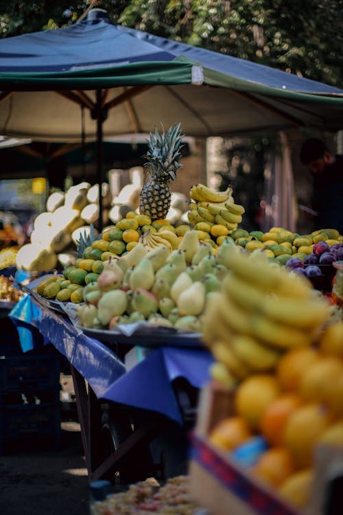 Piles of Fruits Displayed at Street Market Stalls
