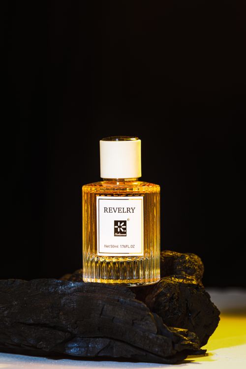 Free Close-up of a revelry perfume bottle with elegant design on dark backdrop. Stock Photo