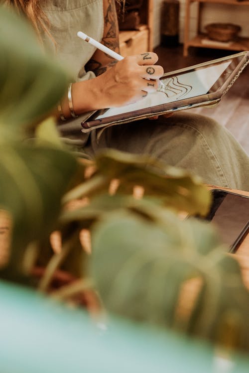 Woman Drawing on Tablet