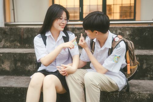Happy School Girls Posing Outdoors in Uniforms · Free Stock Photo