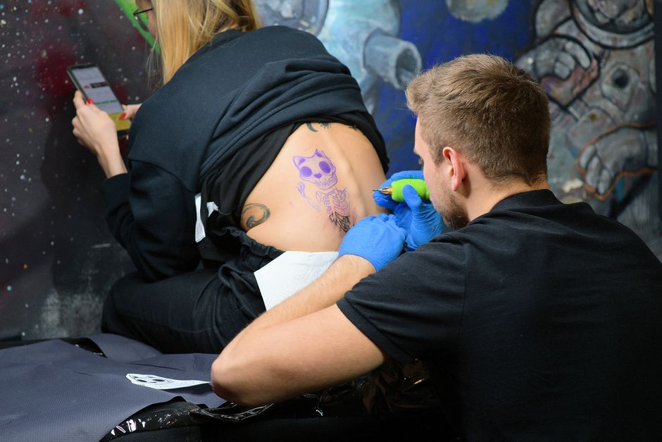 Licensed Tattoo Artist working with sterile equipment in a professional Tattoo Studio Licensed Tattoo Artist working with sterile equipment in a professional Tattoo Studio
