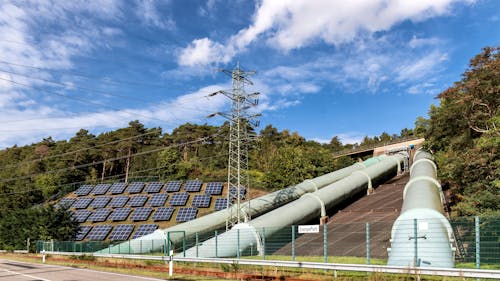 Pipes and Solar Panels on Hill