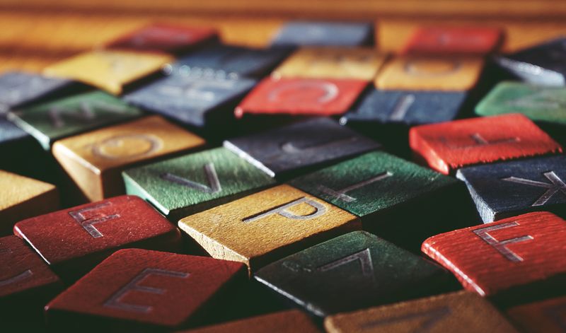 Person holding name letter blocks