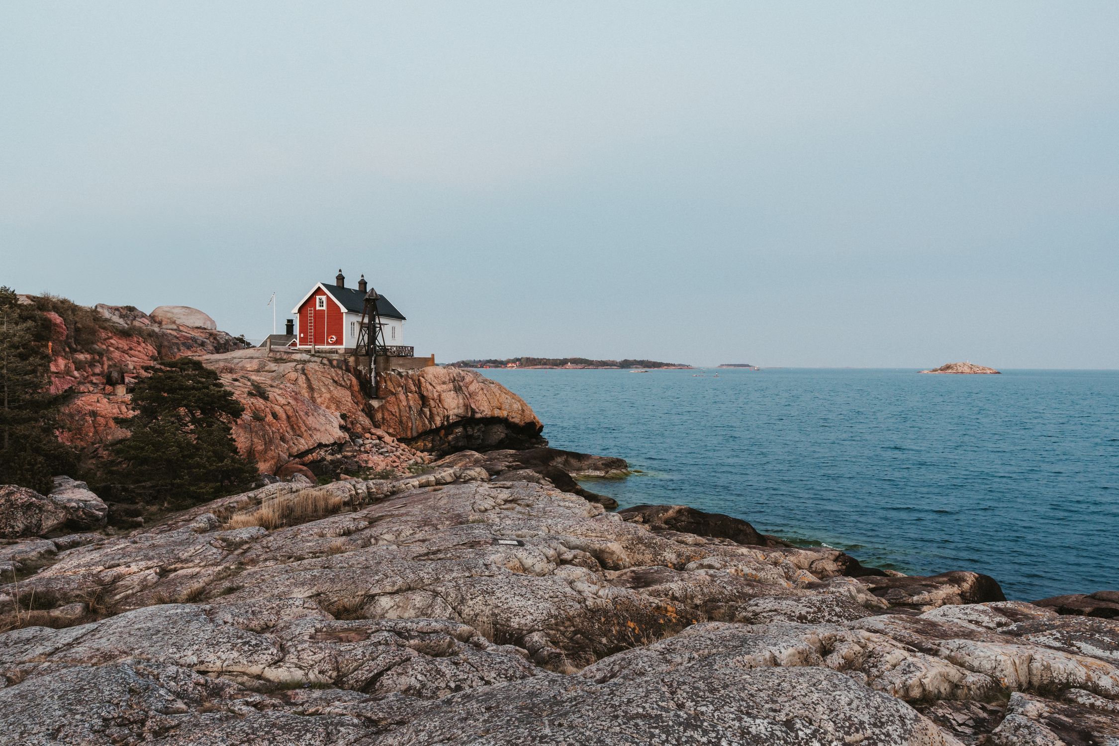 Building on Rocks on Sea Shore in Sweden · Free Stock Photo