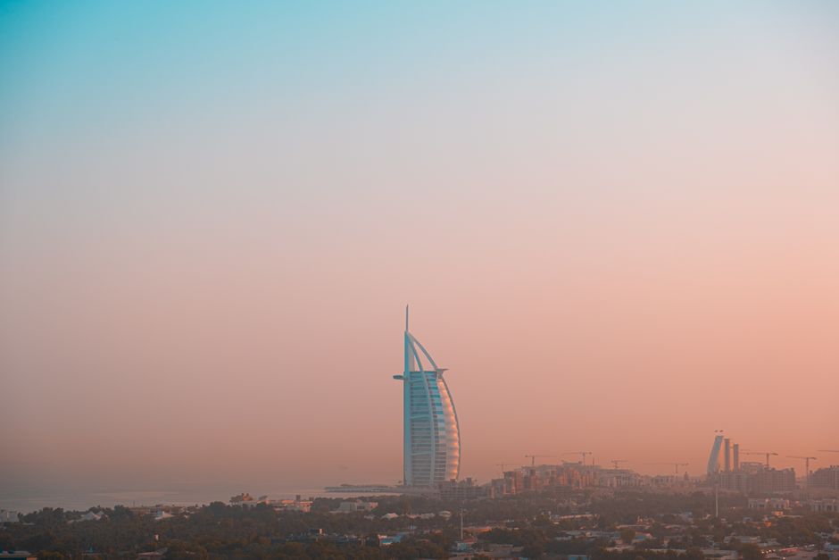 A breathtaking view of the Burj Al Arab with a vibrant evening sky in Dubai.