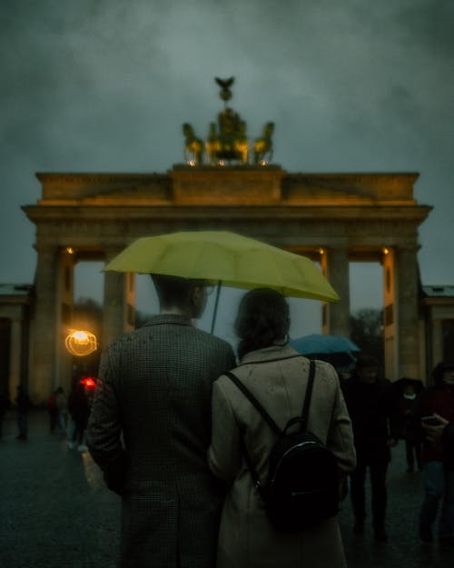 Couple under Umbrella in front of Brandenburg Gate