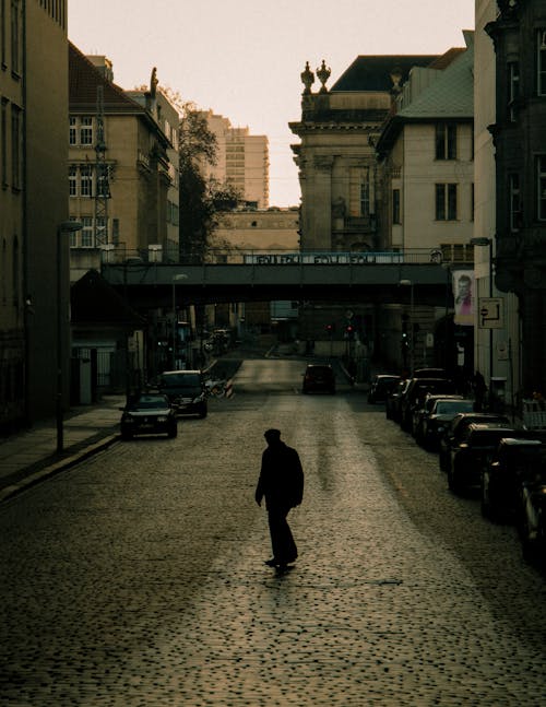 Silhouette of Man on Street in City