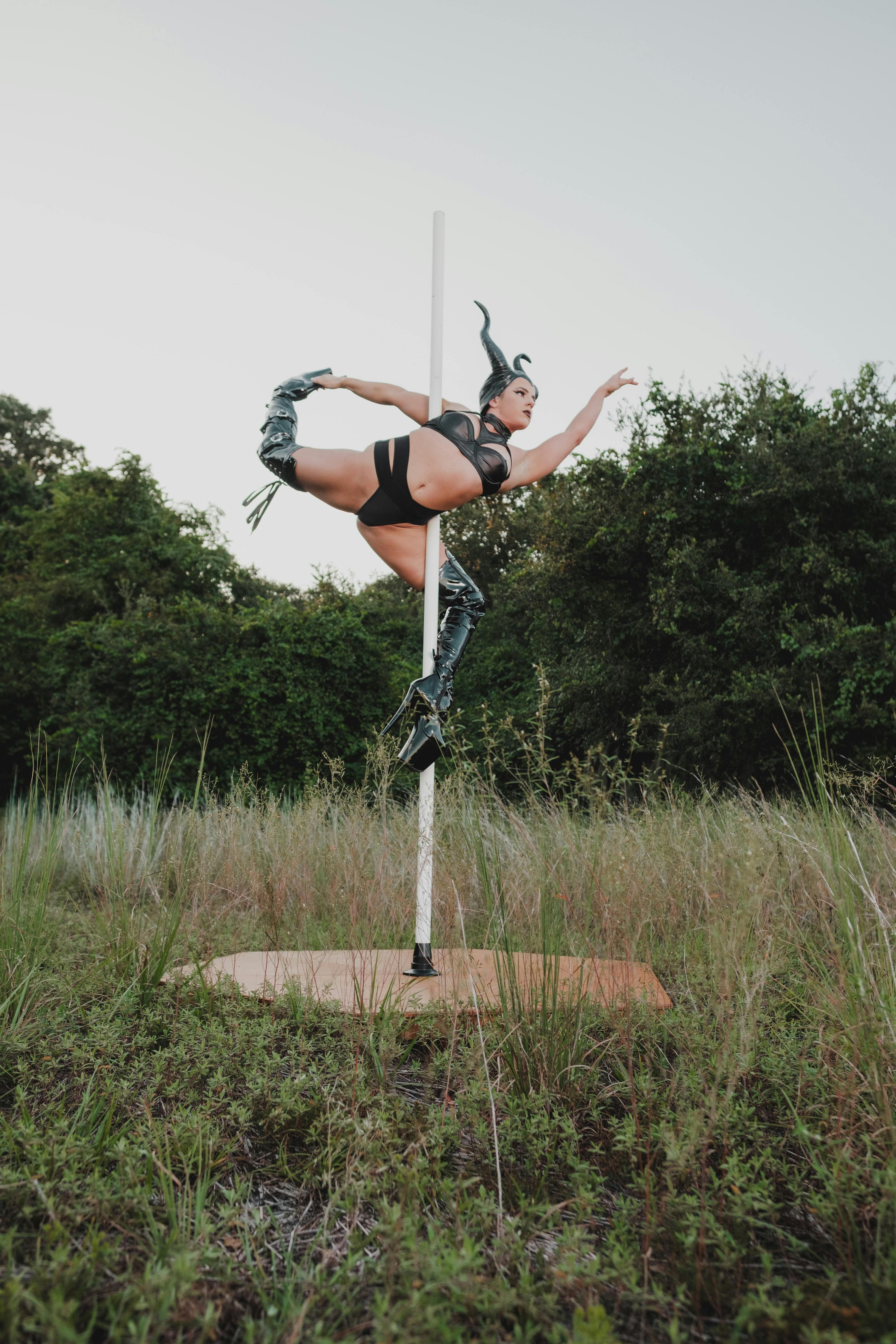 woman dancing on a pole