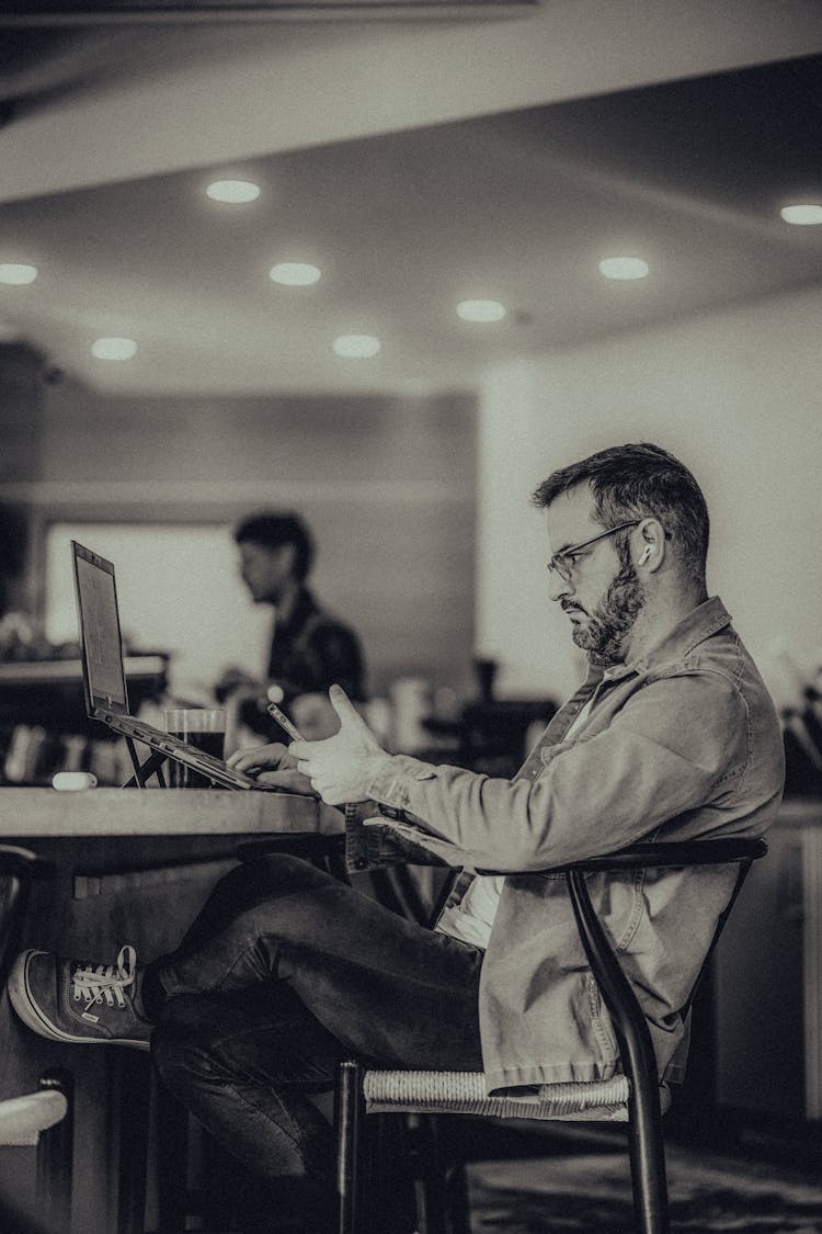 Man Working On Laptop At Office