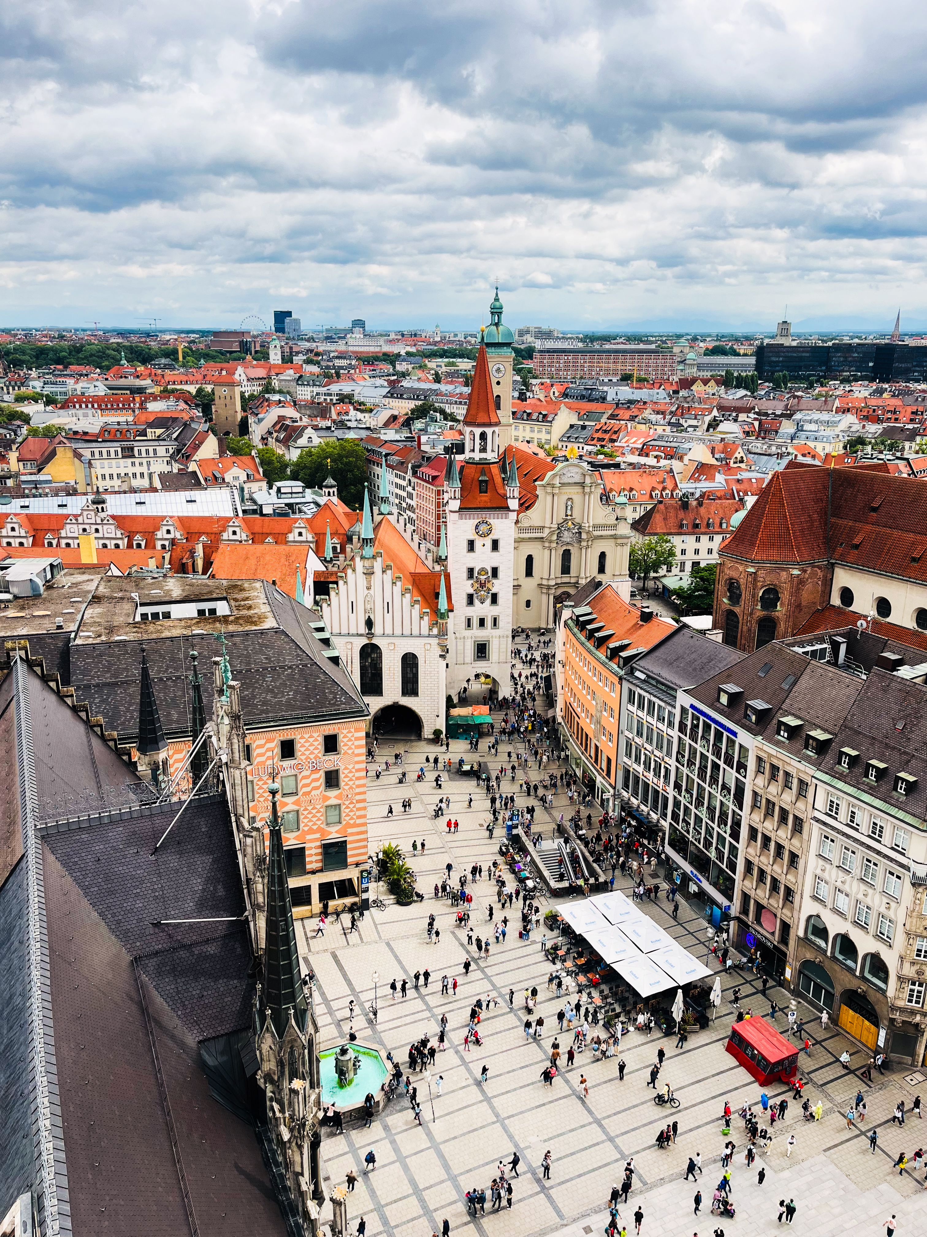 A vibrant aerial view of Munich's Marienplatz square, showcasing architecture and urban life.