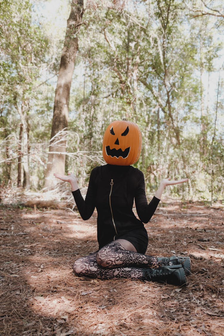 Woman With A Pumpkin On Her Head 