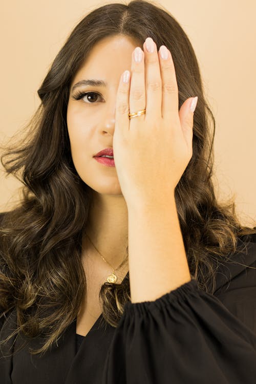 Portrait of Woman with Hand over Face