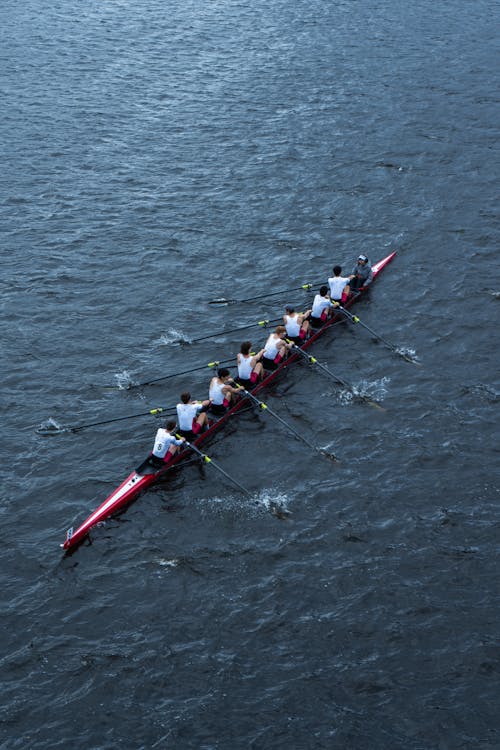 Men Rowing on Lake