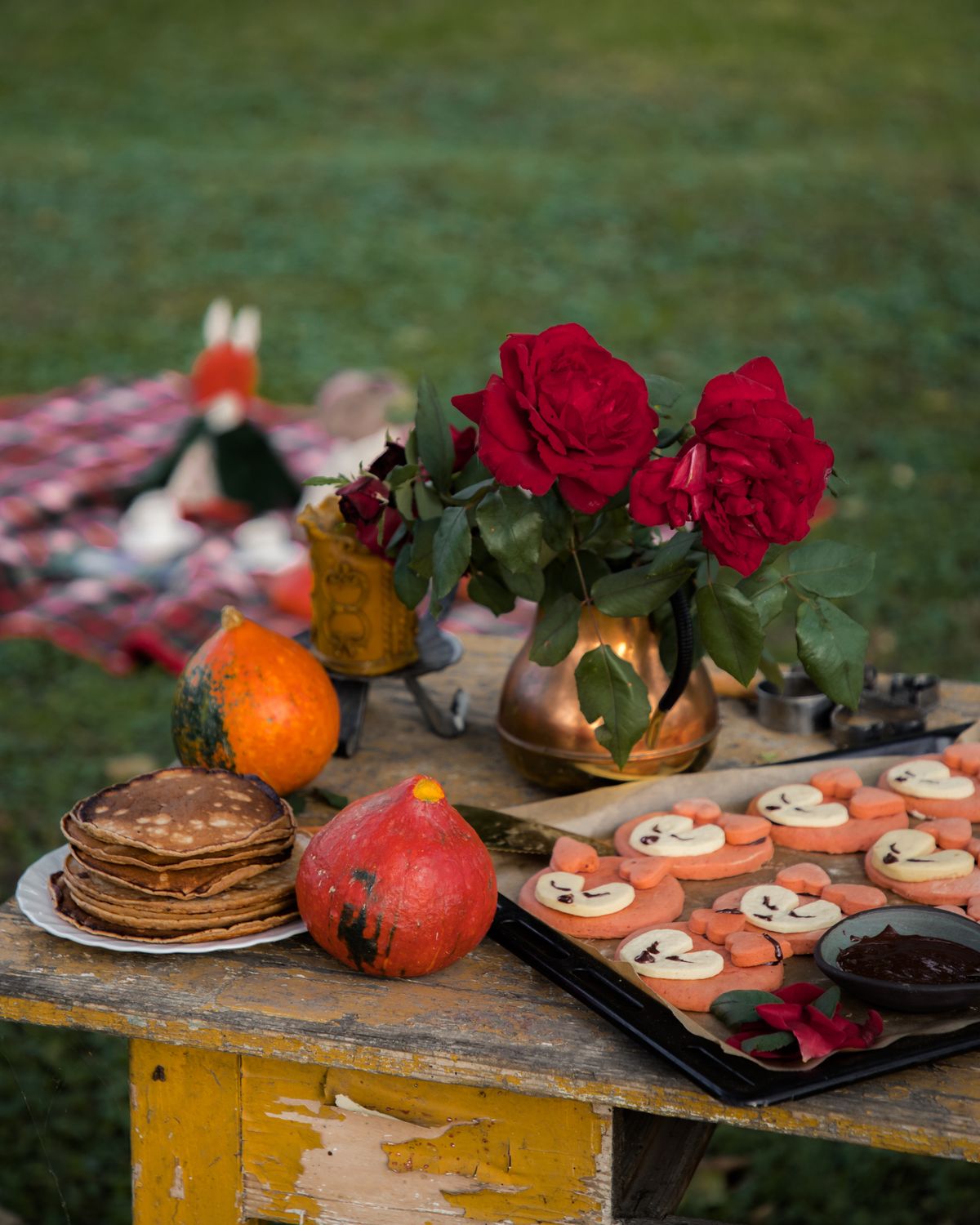 Autumn picnic breakfast spread with pancakes and flowers