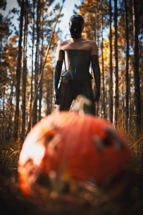 Woman in a Halloween Costume Standing in the Forest