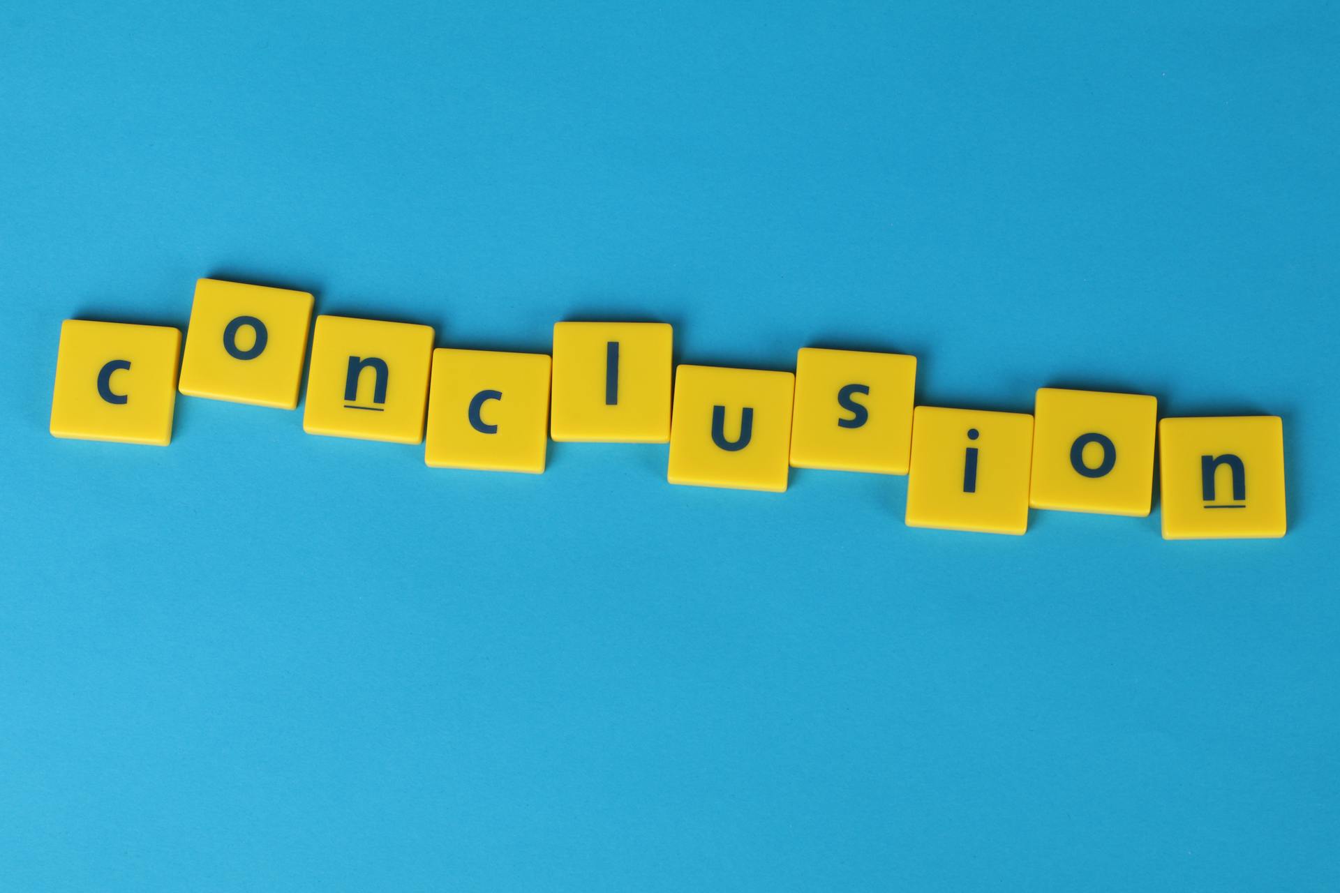 "Conclusion" Word Formed From Lettered Yellow Tiles