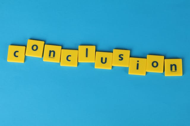 an image of plastic tiles with letters that spell conclusion