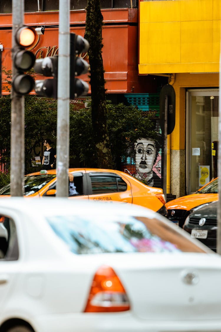 Charlie Chaplin Graffiti On A Busy City Street