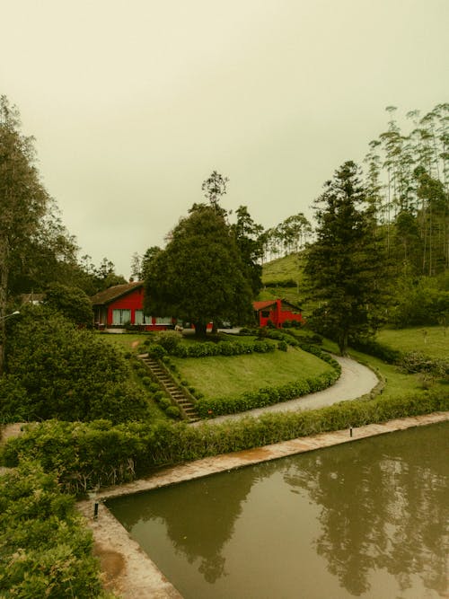 A Red Building by the Pond in a Park 