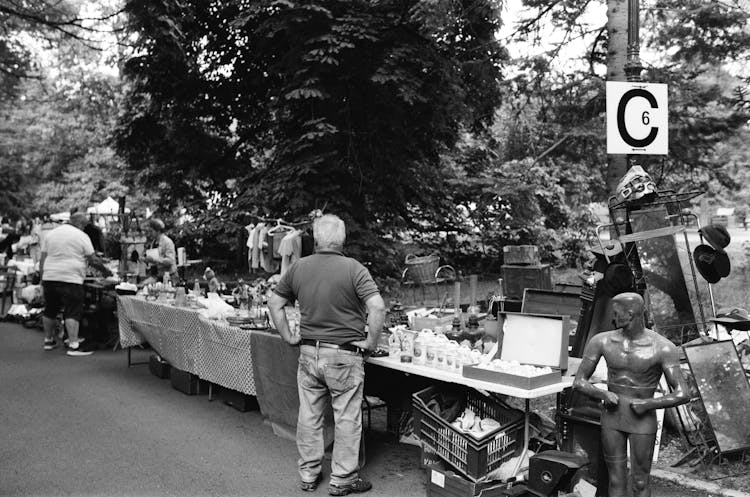 People On A Street Market In Black And White