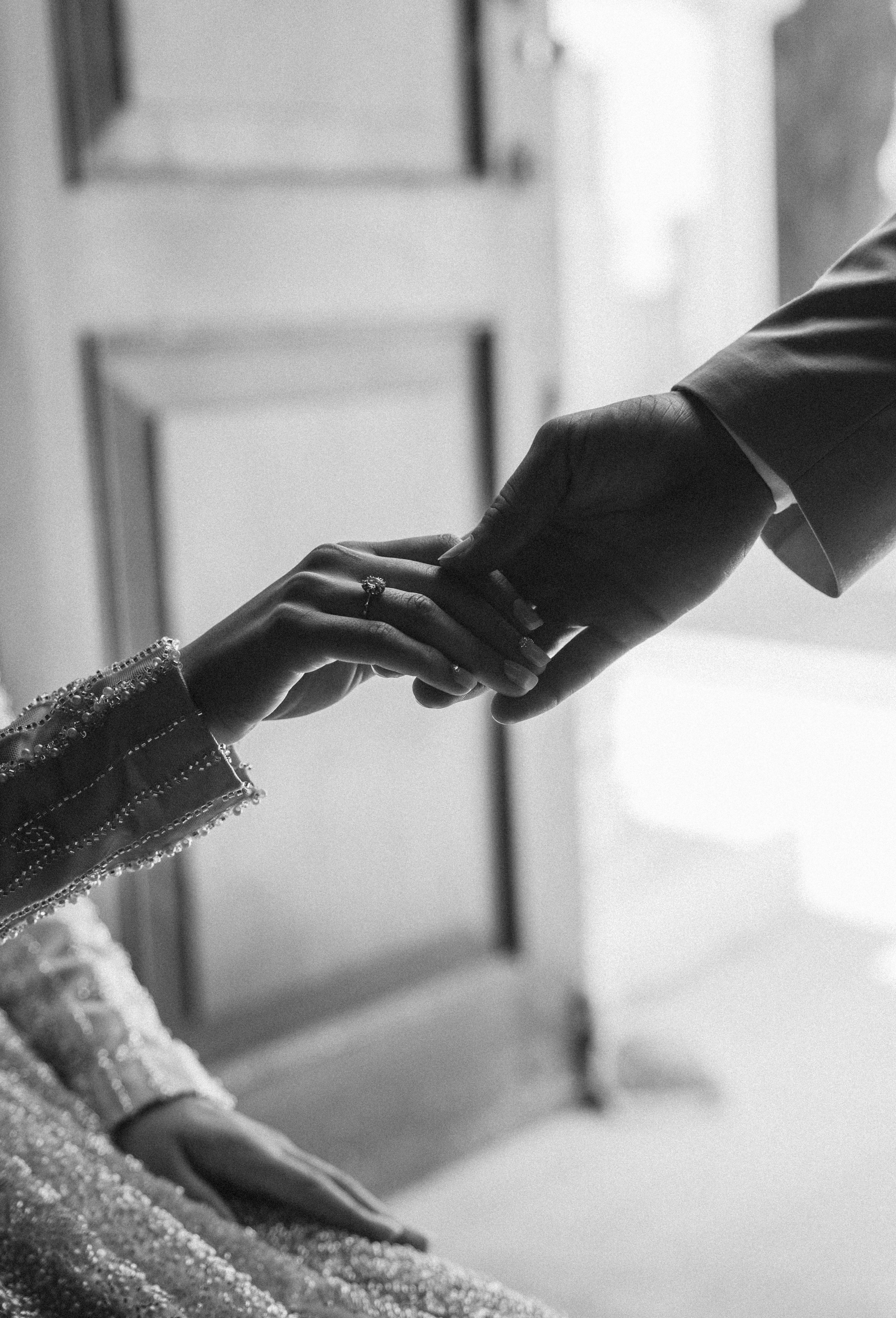 Black and White Photo of People Holding Hands · Free Stock Photo