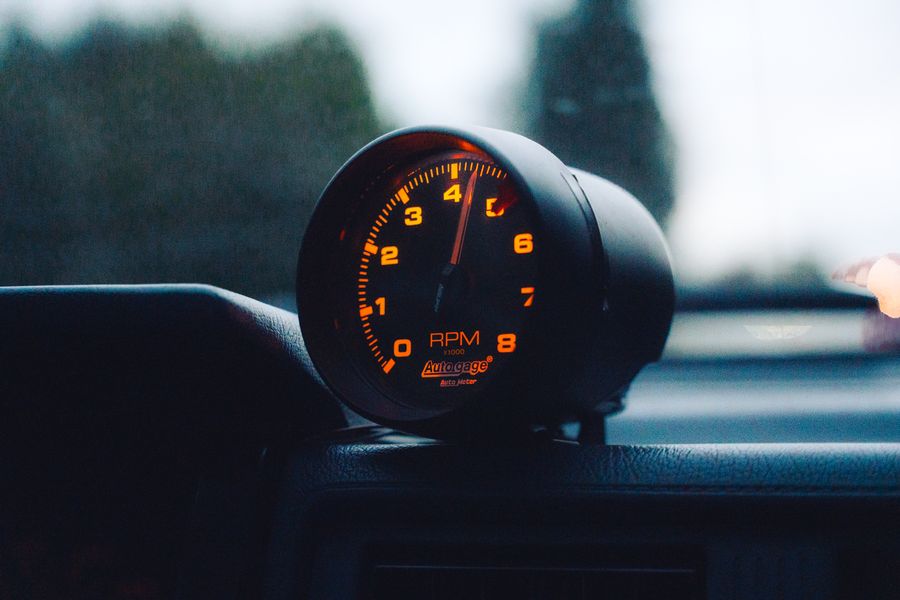 Glowing RPM gauge on a car dashboard