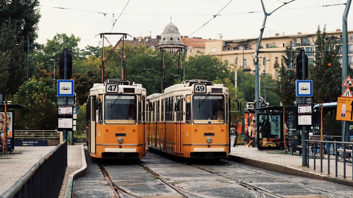 Iconic yellow trams in Budapest, Hungary, capturing urban life and historic charm.