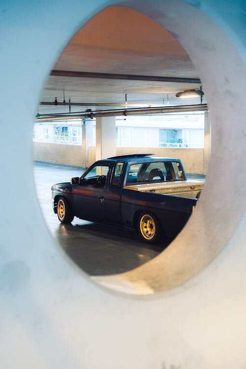 A Nissan Pick-up Truck Parked in the Garage 