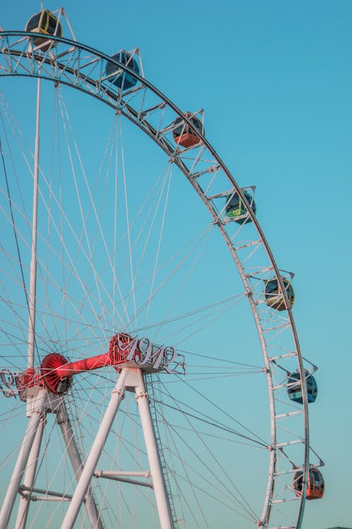 View of Ferris Wheel against Blue Sky 
