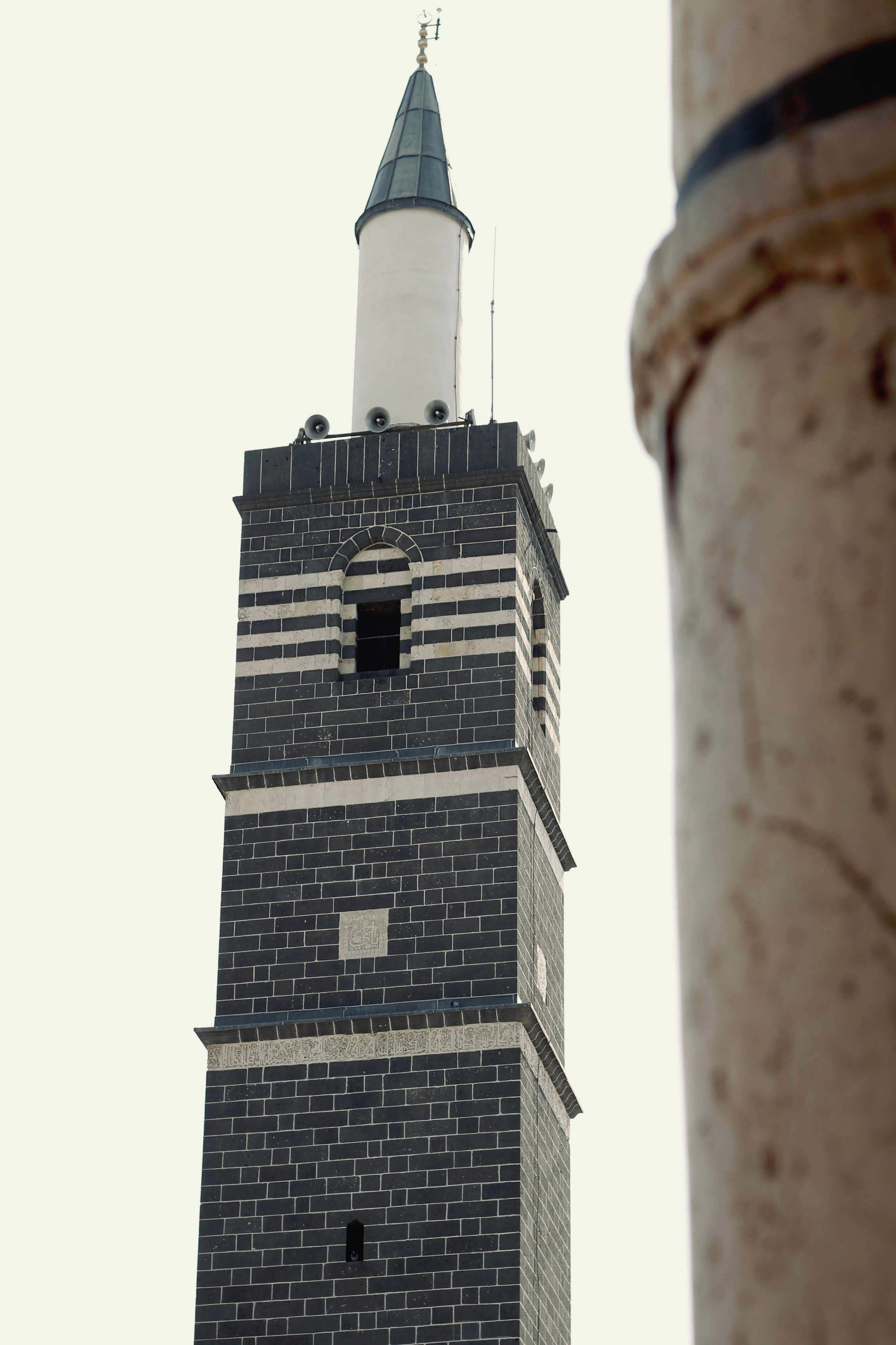 Striking view of the historic minaret in Diyarbakır, showcasing Islamic architecture.