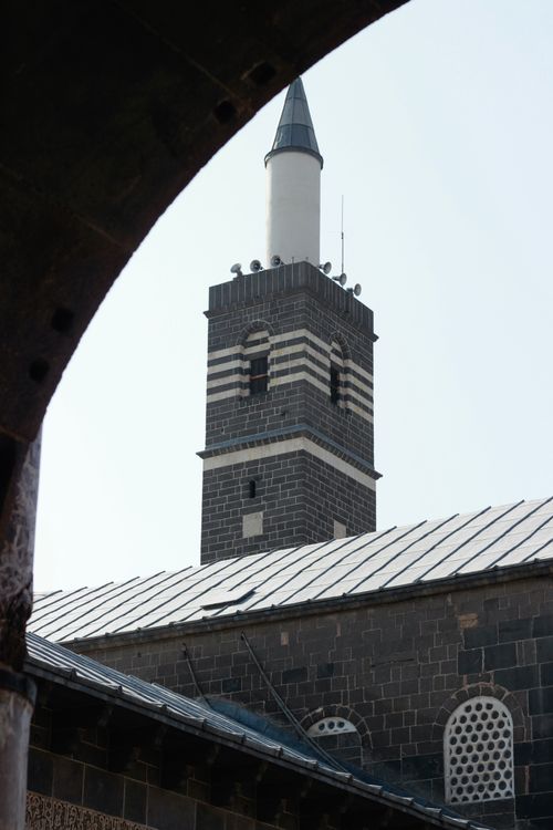 Free Majestic view of the Grand Mosque's minaret in Diyarbakir, showcasing its unique architecture. Stock Photo