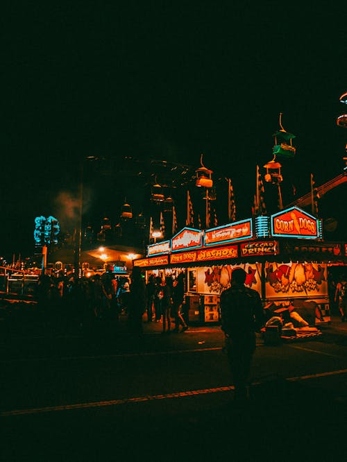 Moody silhouette street shot in amusement park 