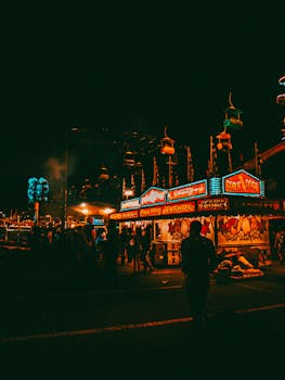 A lively night view of an amusement park in Atlanta, capturing colorful lights and vivid atmosphere.