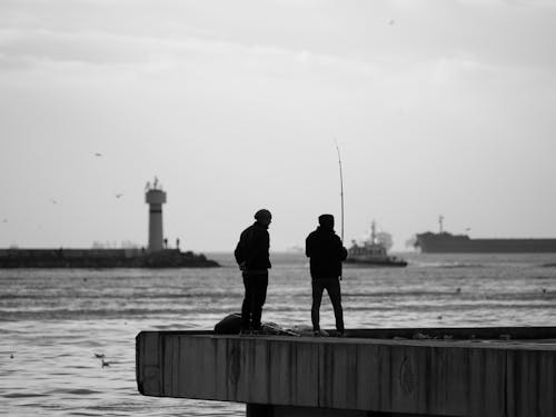 çift, deniz, deniz feneri içeren Ücretsiz stok fotoğraf