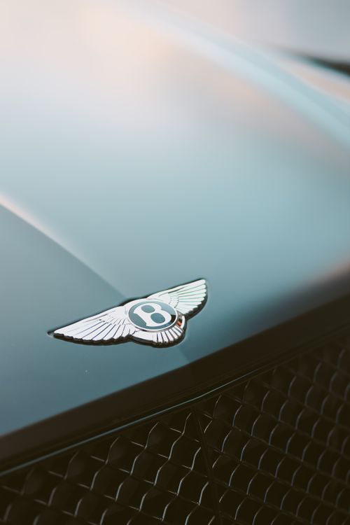 Free A captivating close-up of a luxury car emblem in Dubai, showcasing elegance and style. Stock Photo