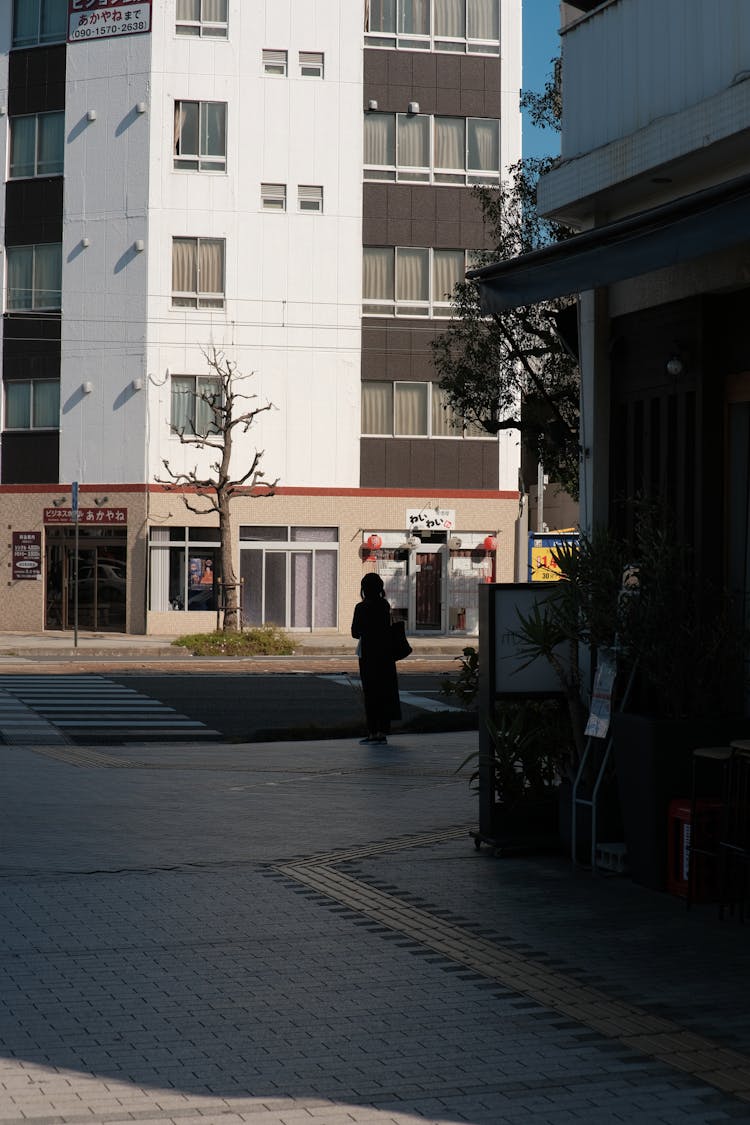 Silhouette Of Woman In City