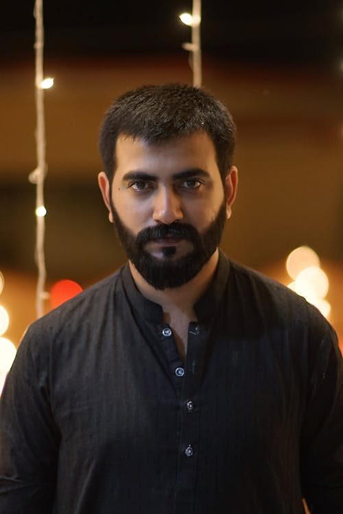 Portrait of a Man with a Beard Wearing a Black Shirt 