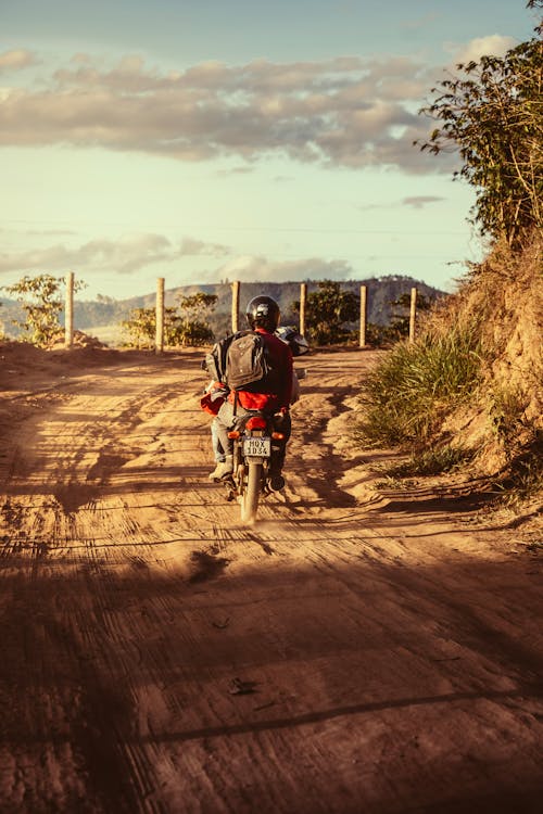 Man Riding on a Motorbike on a Path