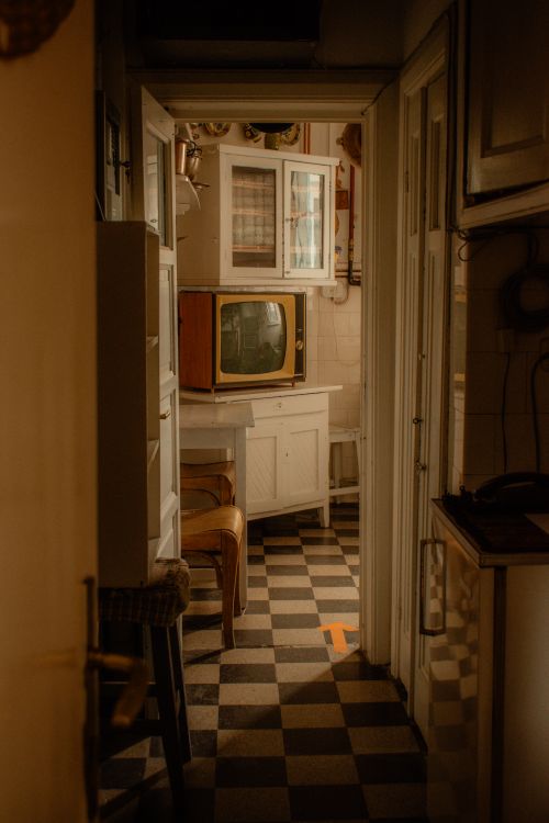 Vintage kitchen and dining corner with a visible checkerboard floor